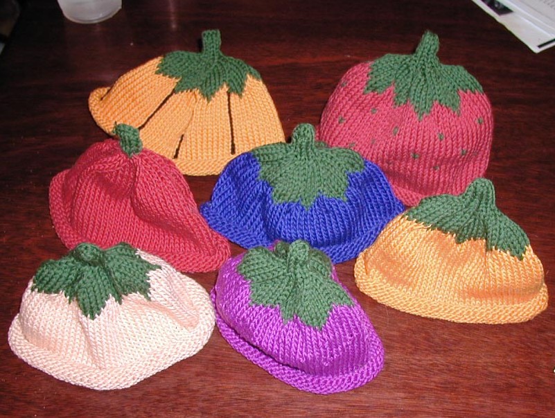 Много. Фруктово-ягодные и другие забавные шапочки