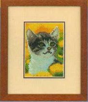 Котенок в одуванчиках